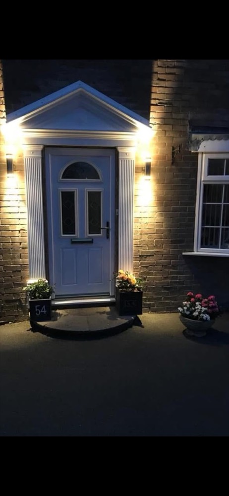 Warm up-and-down wall lights installed either side of a front door in Huddersfield by Lux-smart electrics